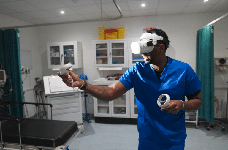 Man in scrubs in VR headset